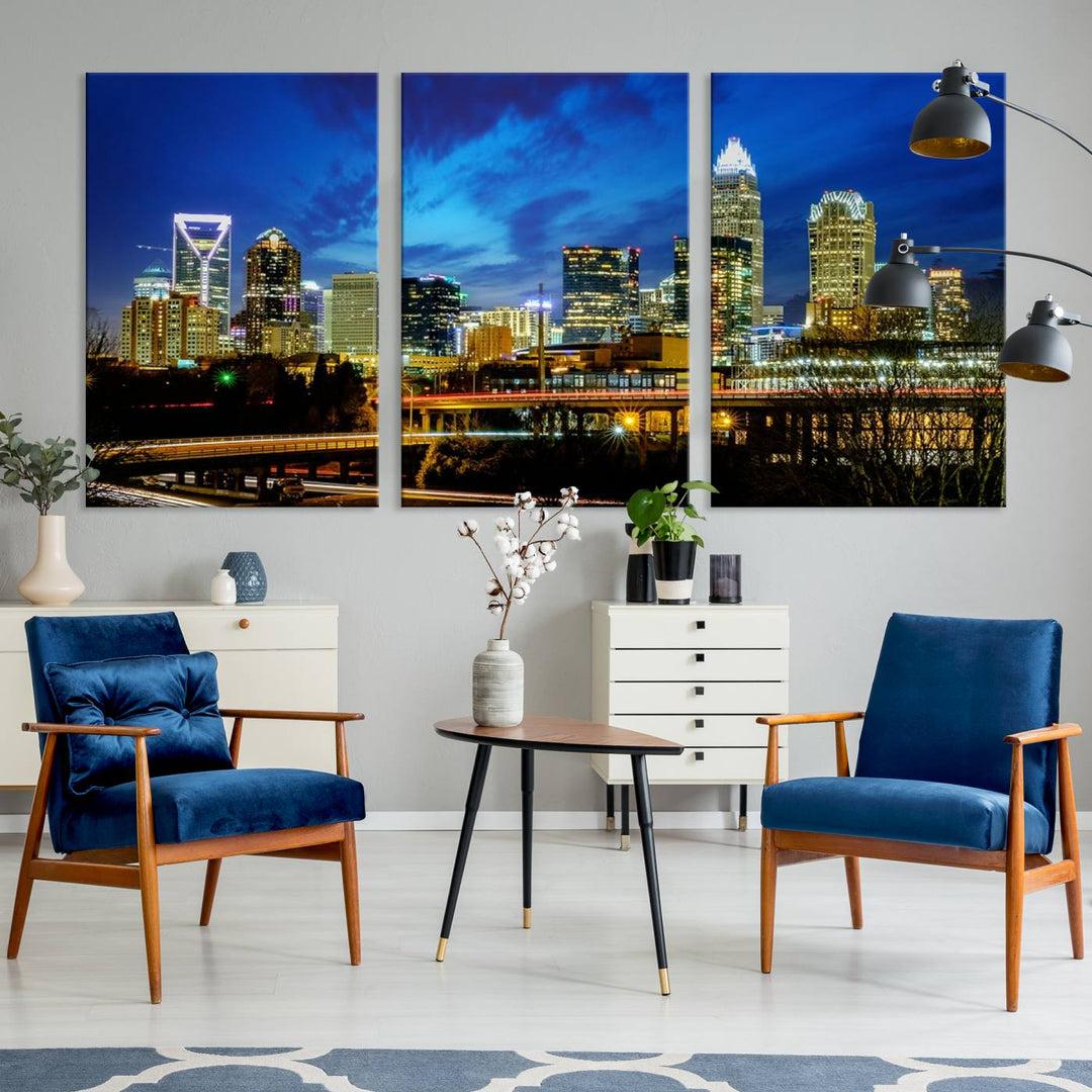 A modern living room highlighted by the "Charlotte City Lights Cloudy Blue Night Skyline Cityscape View" wall art canvas print, crafted on museum-quality canvas with UV-protective coating.