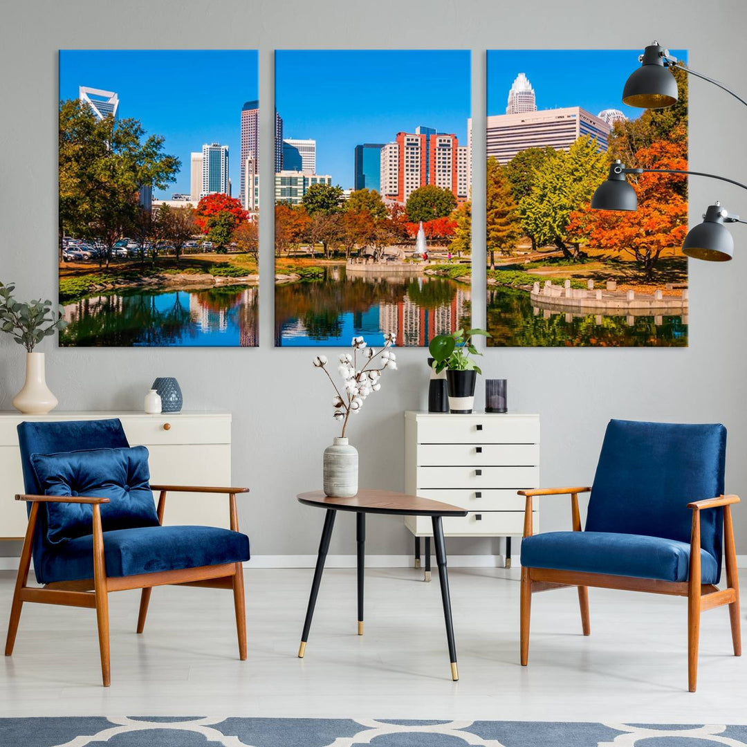 The Charlotte City Park at Fall Skyline Cityscape View wall art canvas print features a city panorama with a park and lake accented by autumn trees. It is mounted on museum-quality canvas with UV-protective coating and decorates the space.