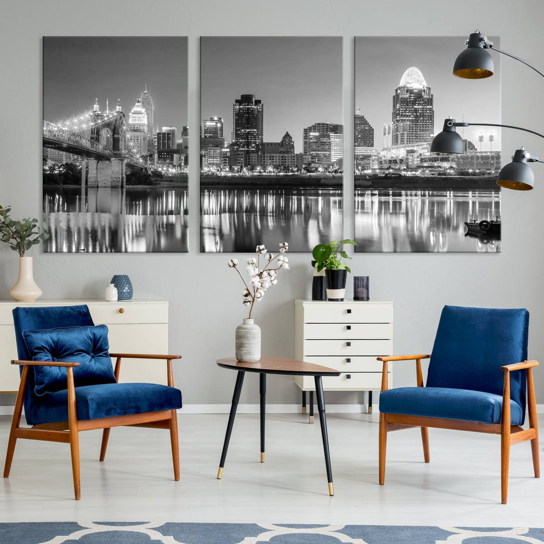 The "Cincinnati City Lights Skyline Black and White Wall Art Cityscape Canvas Print" is elegantly displayed in a stylish living room.