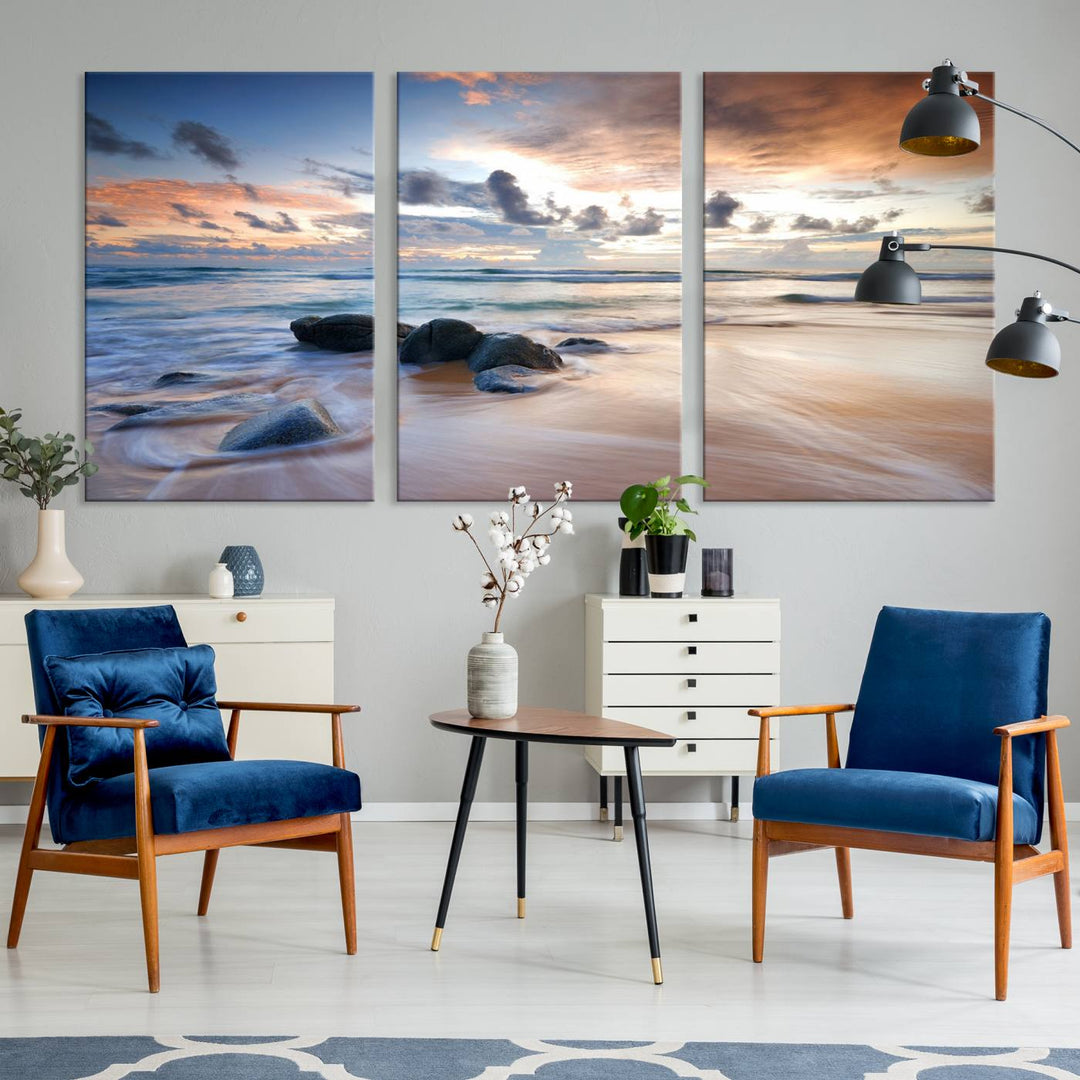 The "Serene Weather On The Beach Wall Art Canvas Print," featuring a tranquil beach scene with rocks and waves, is ready to hang and enjoy.