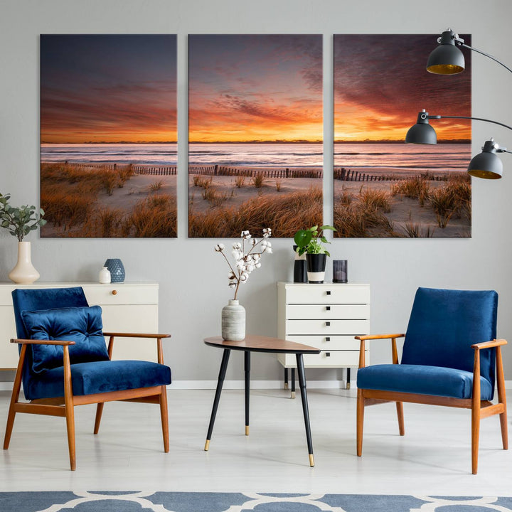 Sunset on The Beach Wall Art Canvas Print features a triptych of a beach at sunset with vivid orange skies, presented on museum-quality canvas. Each section is gallery wrapped, offering lasting beauty with its UV-protective coating.