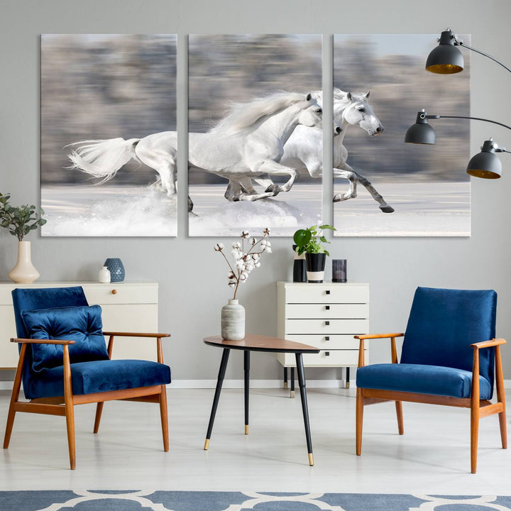 The "All The White Horses Wall Art Canvas Print" depicts a triptych of galloping white horses across a snowy landscape. These museum-quality canvases come with a UV-protective coating to maintain their stunning appearance over time.