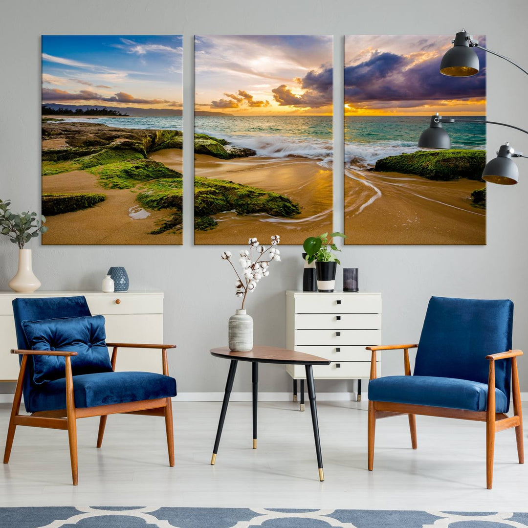 The Sunset Beach Wall Art Canvas Print is a gallery-wrapped triptych showcasing a beach scene with mossy rocks and a vibrant sunset. Made from museum-quality canvas and featuring a UV-protective coating, it elegantly provides both beauty and durability.