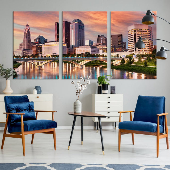 The "Columbus City Lights Sunset Orange Cloudy Skyline Cityscape View" wall art is featured on the wall. This triptych is printed on museum-quality canvas and includes a UV-protective coating, ensuring lasting vibrancy.