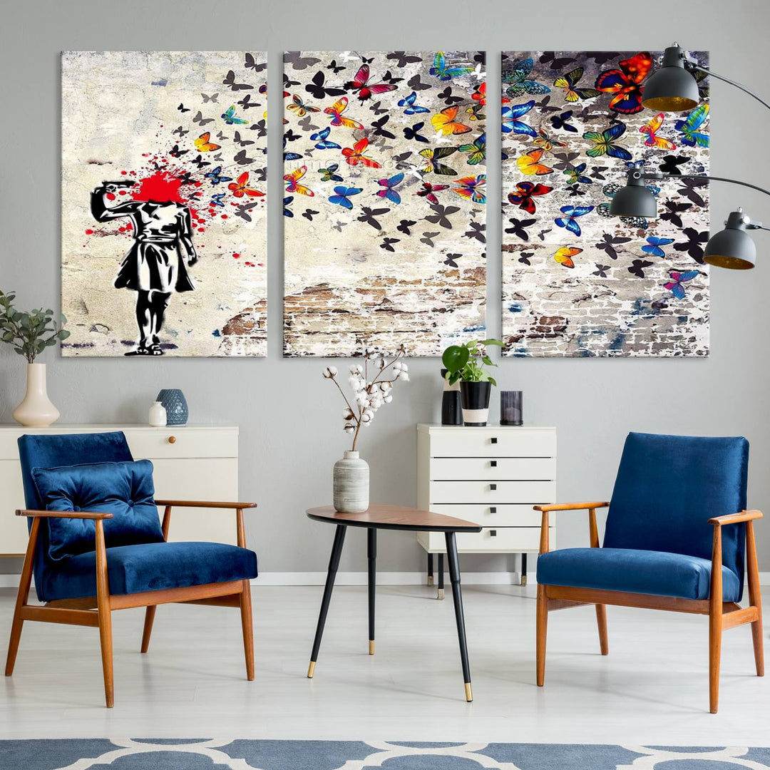 The Banksy Art Butterfly Girl Explosion Canvas showcases a dynamic figure with butterflies bursting from their head, set against a textured wall background. This vibrant urban graffiti piece is perfect for modern interiors and comes ready to hang.