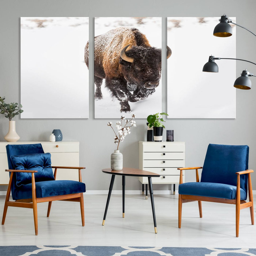 The Bison Winter Wall Art Canvas Print for Farmhouse Decor is displayed as a triptych in the living room. This artwork, printed on museum-quality canvases with a UV-protective coating to maintain its vibrant colors, is the focal point of the space.