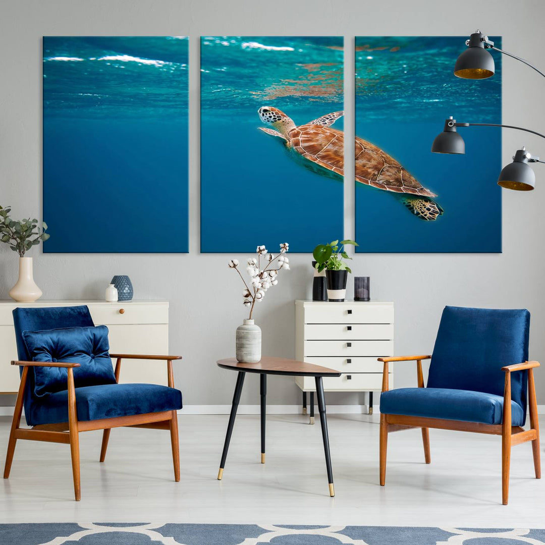 The living room features the "Baby Turtle in Ocean" wall art canvas print. This gallery-quality piece, depicting a sea turtle swimming underwater, adds an elegant touch to the space.