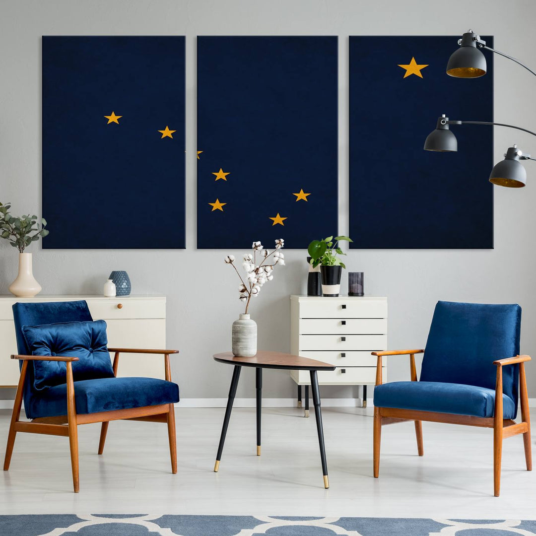 A contemporary living room featuring a triptych artwork of stars on a navy background, accentuated by the striking Alaska States Flag Wall Art Canvas Print.