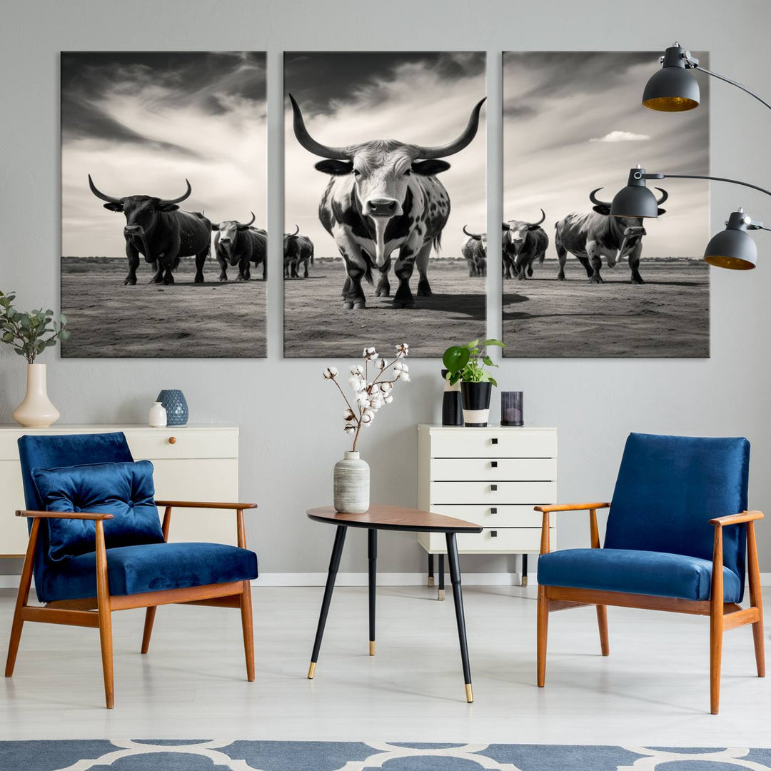 The Black and White Longhorn Cattle Wall Art, featuring a three-panel display of cowboy Western longhorns walking toward the viewer, enhances your space with its striking presence, adding a touch of Western decor.