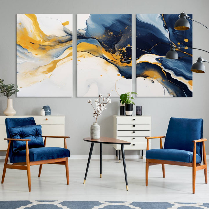 The Blue and Gold Abstract Fluid Canvas Art, with its swirling patterns, adorns the wall. This modern wall art beautifully complements the contemporary interior decor, adding an elegant touch with its rich blue, gold, and white tones.