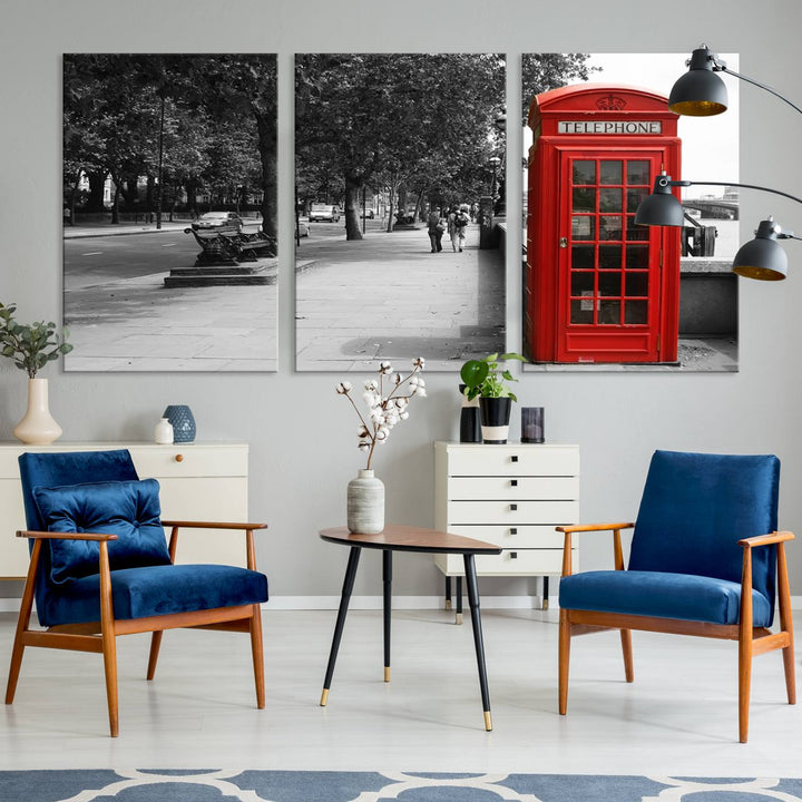 The London Phone Club Wall Art is a stunning piece that showcases a red telephone box set in a black and white street scene on museum-quality canvas. It is gallery wrapped with a UV-protective coating to preserve its vibrant charm.