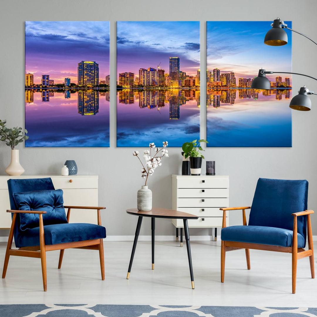 The Miami City Wall Art Canvas Print, featuring a three-panel depiction of a city skyline at sunset reflected in water, beautifully enhances the wall. Made with museum-quality canvas and a UV-protective coating, it comes ready to hang.