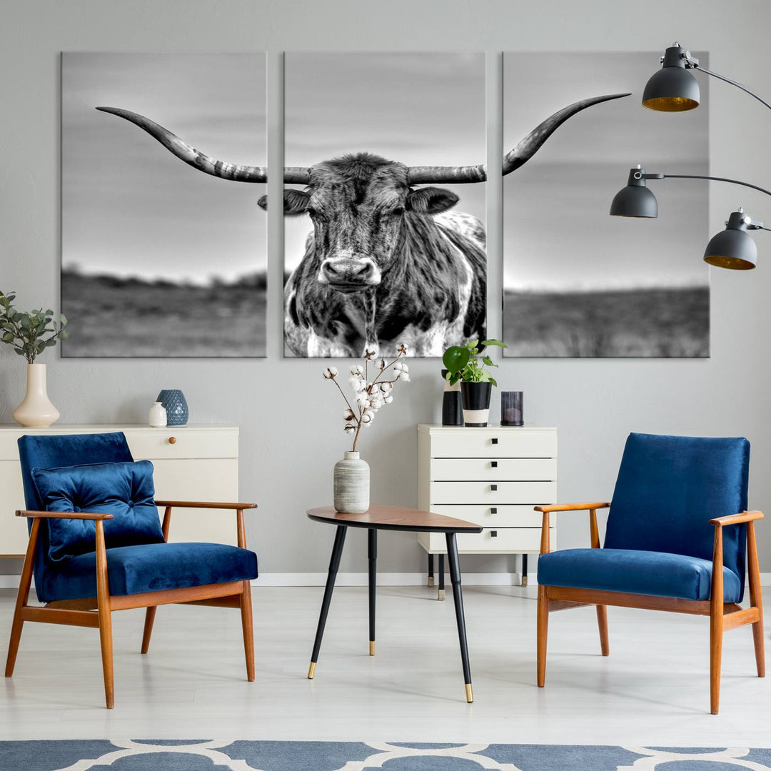 The Texas Longhorn Cow Wall Art, featuring a black and white image of a longhorn bull on canvas, brings charm to the room with its sophisticated appeal.