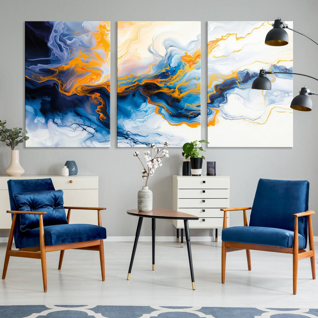 A stunning Fluid Alcohol Ink Wall Art with Gold Wall Art Canvas Print, featuring vibrant blue, orange, and white swirls, adorns the wall. This gallery-quality finish adds an exquisite touch to any living space.