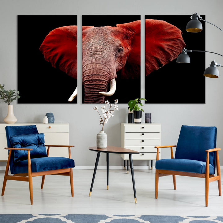 A Wall Art Canvas Print in the modern living room features a three-panel premium design of a red elephant face.