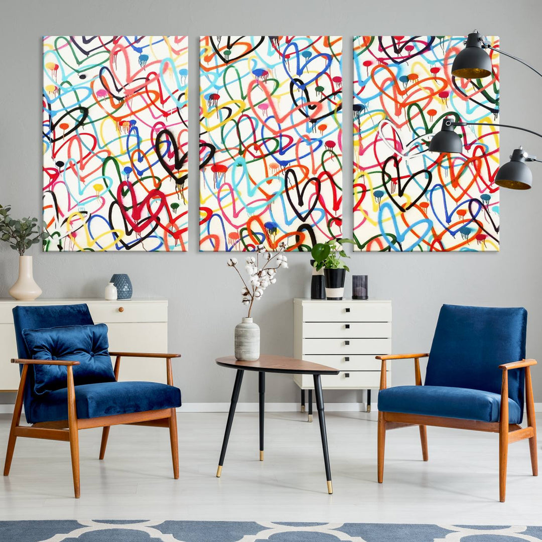 The Colorful Graffiti Love Canvas Print, a street art masterpiece with vibrant abstract swirls and a gallery-quality finish, hangs prominently on the wall.