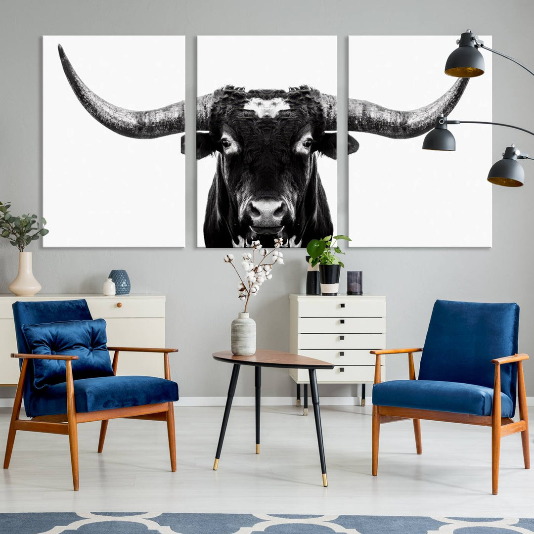 The living room is adorned with the Texas Cow Longhorn Wall Art Canvas Print in Black and White—framed and ready to hang.