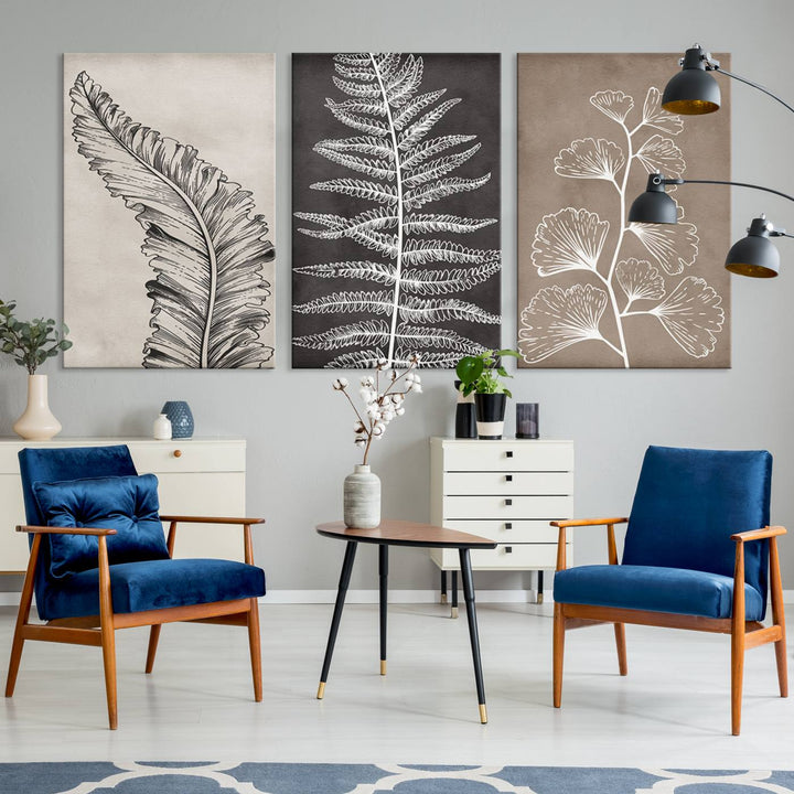 The Botanical Leaf Art Collection - 3-Panel Wall Art Canvas Print is framed above a modern console table.