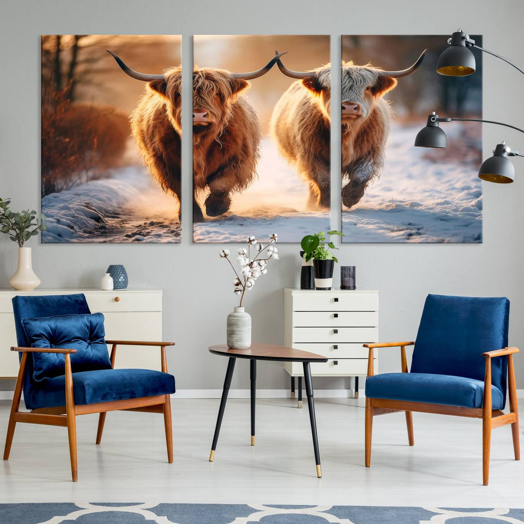 The living room showcases a triptych from the Scottish Highland Cow Horn Farm Wall Art Canvas Print collection, depicting two Highland cows running in the snow. Complementing this are handmade wall art pieces with a gallery-quality finish that add an elegant touch.