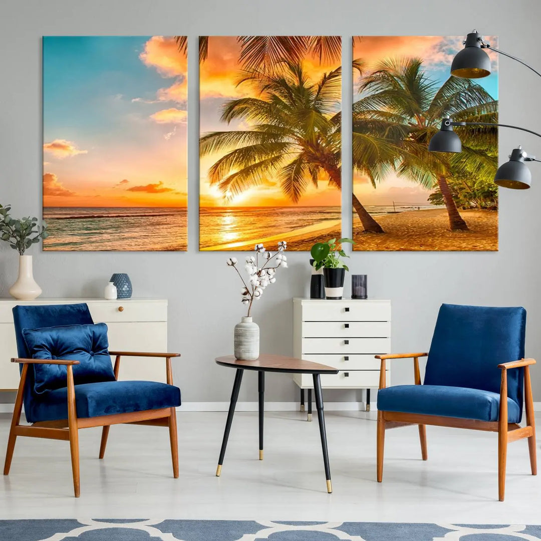 The Tropical Sunset Wall Art Print features a vibrant beach scene with palm trees and an ocean view highlighted by a golden sunset.