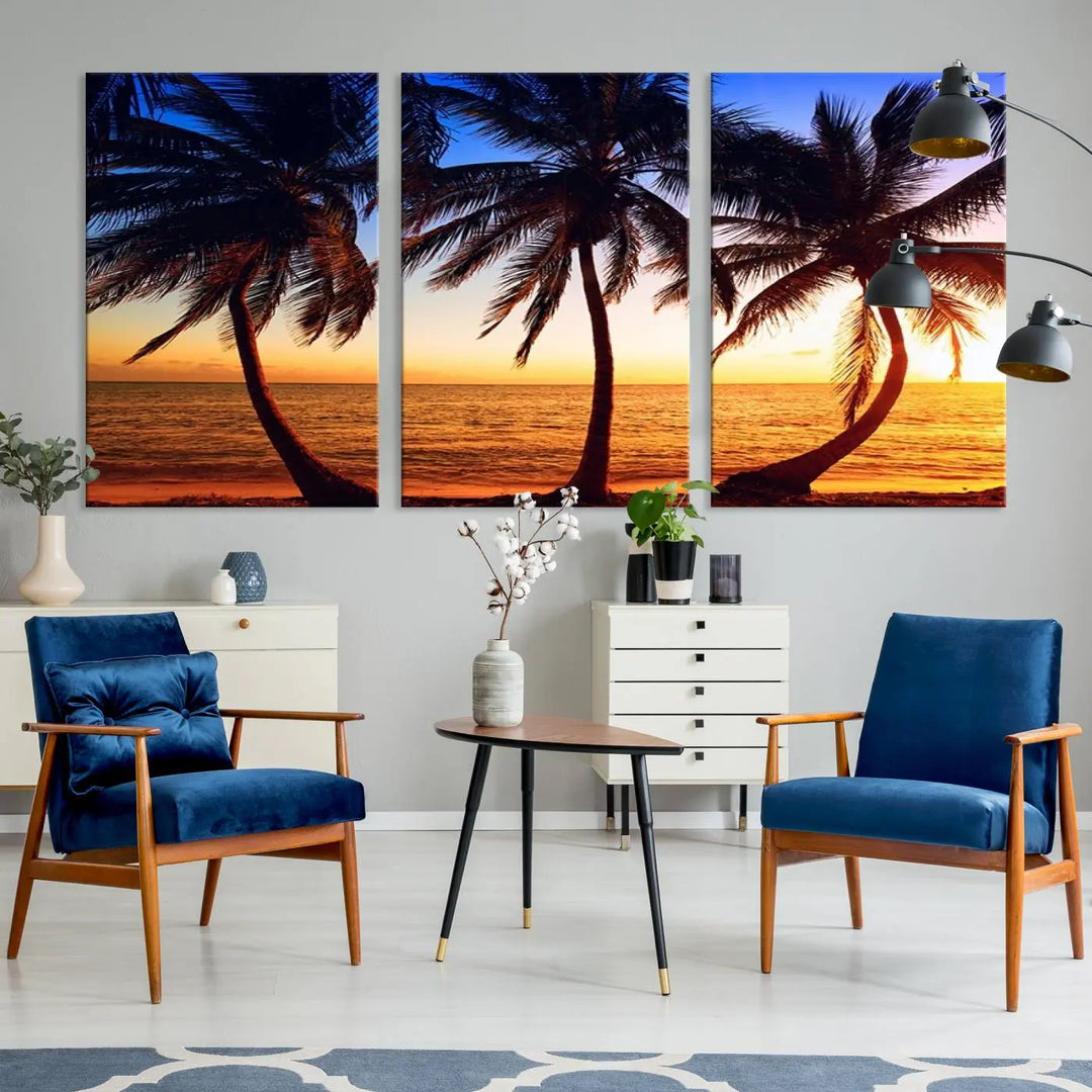 The living room features a wall adorned with the "Wall Art Canvas Curve Palms at Sunset on Beach," showcasing gallery-wrapped, museum-quality canvases in a stunning triptych.