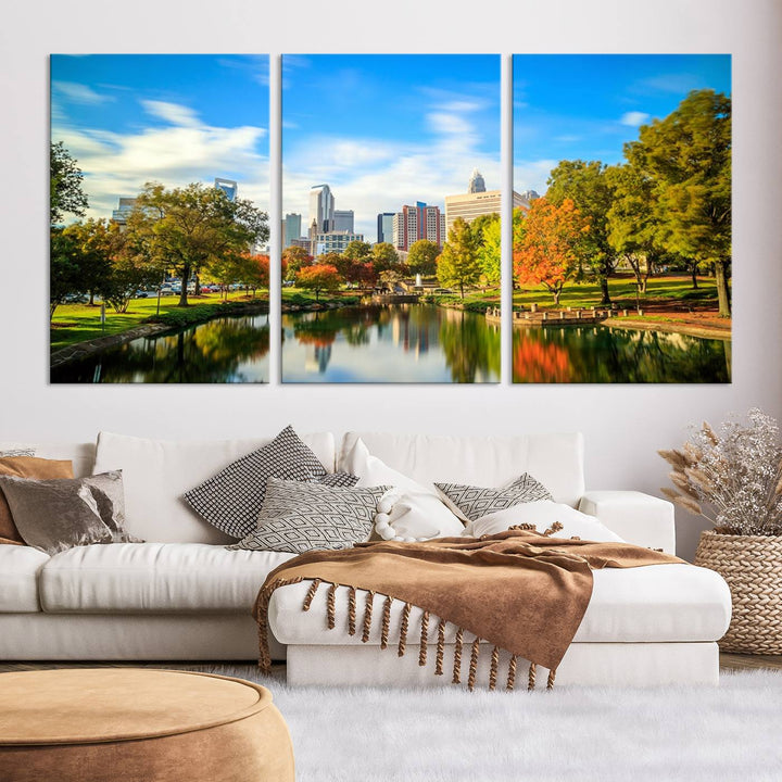 The Charlotte City Park at Spring Skyline Cityscape View wall art canvas print is a triptych featuring a scenic park with a lake and city skyline. It is gallery-wrapped on museum-quality canvases.