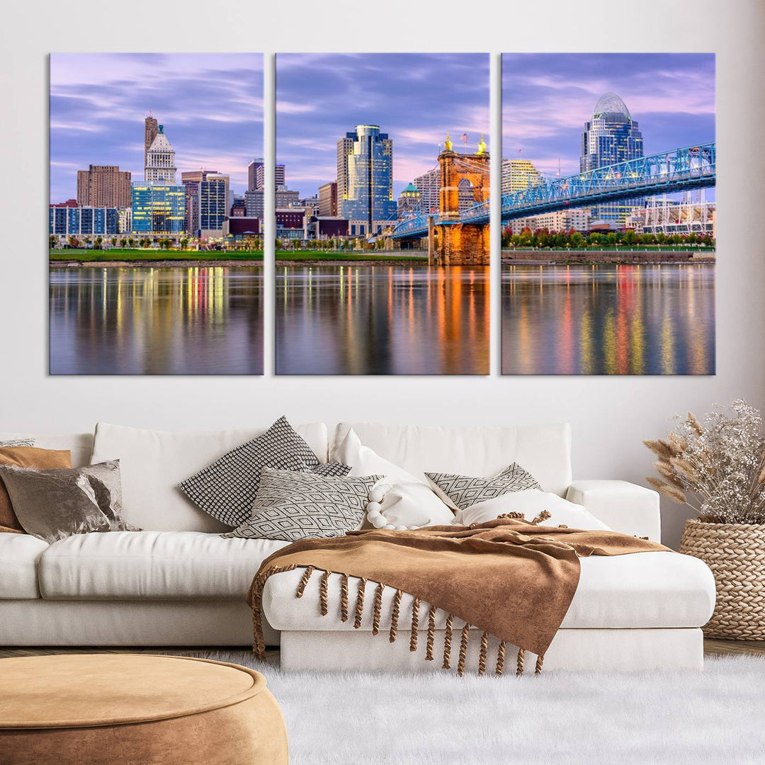 The wall art titled "Cincinnati City Lights Sunset Purple Cloudy Skyline Cityscape View" is beautifully printed on museum-quality canvases with a UV-protective coating and is ready to hang.