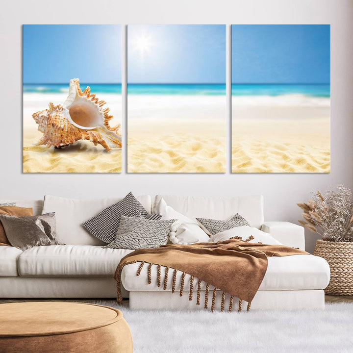 The Sea Shell on The Beach Sun Sand Wall Art Canvas Print is a triptych that beautifully captures a beach scene with a large seashell on the sand.