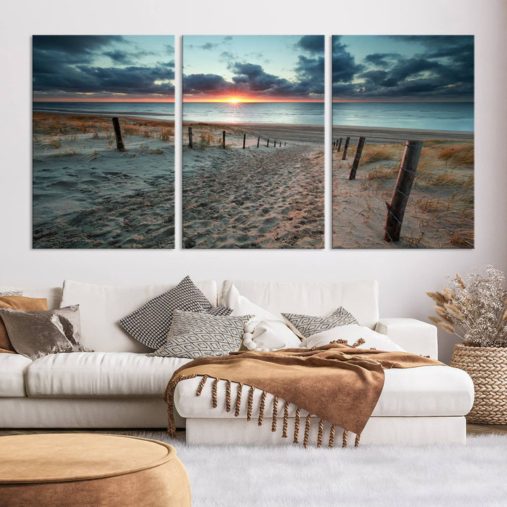 The modern living room features the Cloudy Weather Sunset Beach Wall Art Canvas Print. This museum-quality canvas adds a touch of sophistication with its hand-assembled framed art, ensuring lasting elegance. Enjoy free shipping on this exquisite piece.