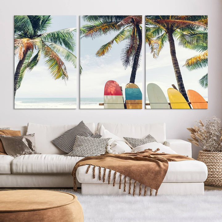 The room showcases The Palm and Surfing Board Wall Art Canvas Print, a triptych of palm trees and surfboards by the beach, elegantly gallery wrapped for a sophisticated finish.