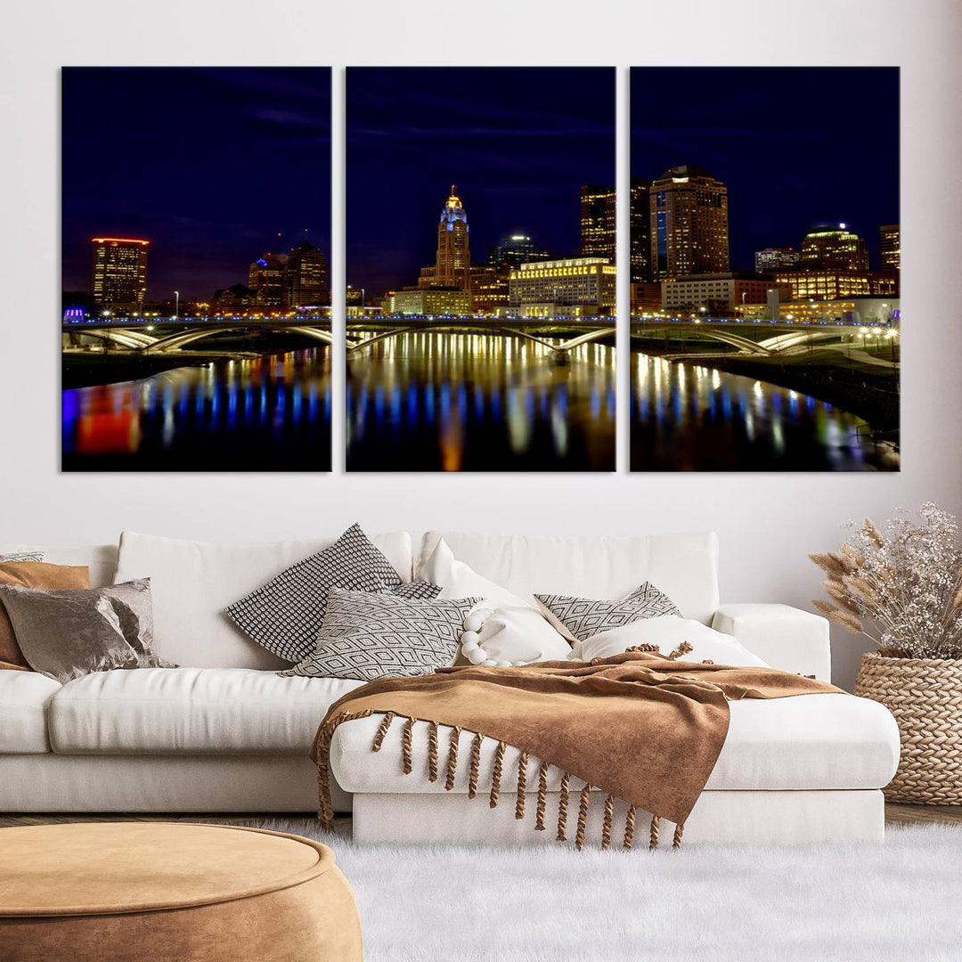 The "Columbus City Lights Night Skyline Cityscape View Wall Art Canvas Print" showcases a stunning city skyline at night, with illuminated buildings and bridges reflecting in the river, on a museum-quality canvas ready to hang.