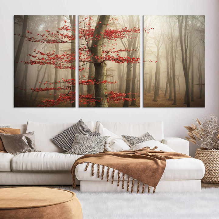 The living room features the Foggy Forest Wall Art, an Autumn Trees Canvas Print that showcases a serene nature scene with foggy woodland decor and a tree adorned in vibrant red leaves.