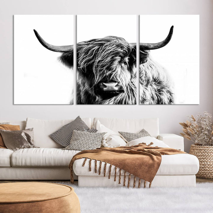 The Scottish Highland Cow Cattle Art Print Farmhouse Wall Art Canvas Print enhances rustic farmhouse decor with its depiction of a long-haired, large-horned cow. This triptych is an ideal choice for chic wall art.