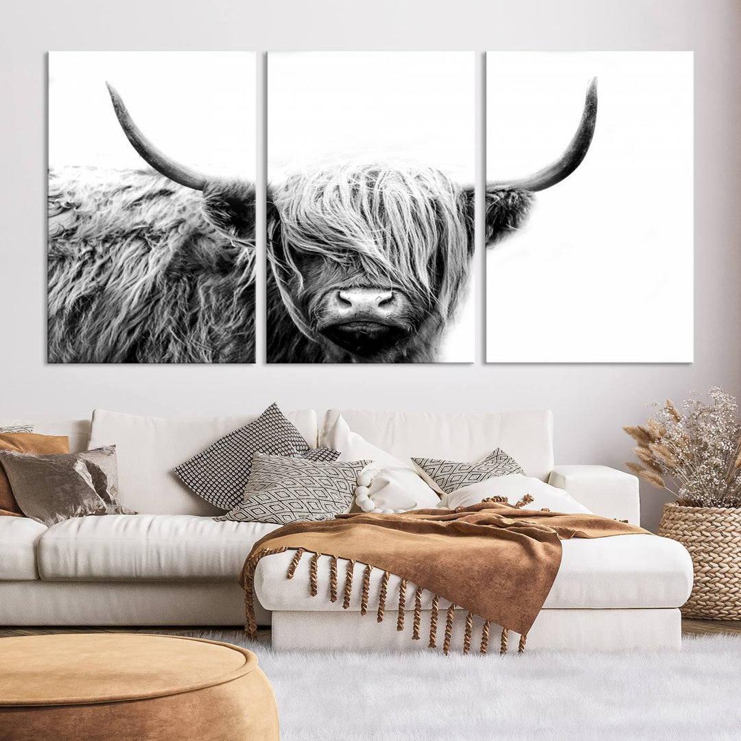 A museum-quality triptych titled "Black White Scottish Highland Cow Cattle Art Print Farmhouse Wall Art Canvas Print" embellishes the dark wall. The canvas is equipped with a UV-protective coating to ensure lasting vibrancy.