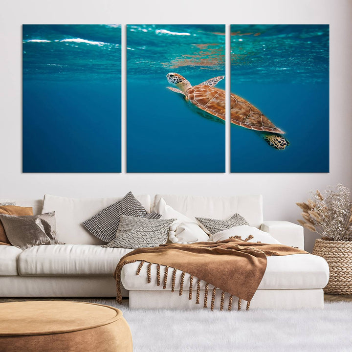 The living room features the "Baby Turtle in Ocean" wall art canvas print. This gallery-quality piece, depicting a sea turtle swimming underwater, adds an elegant touch to the space.