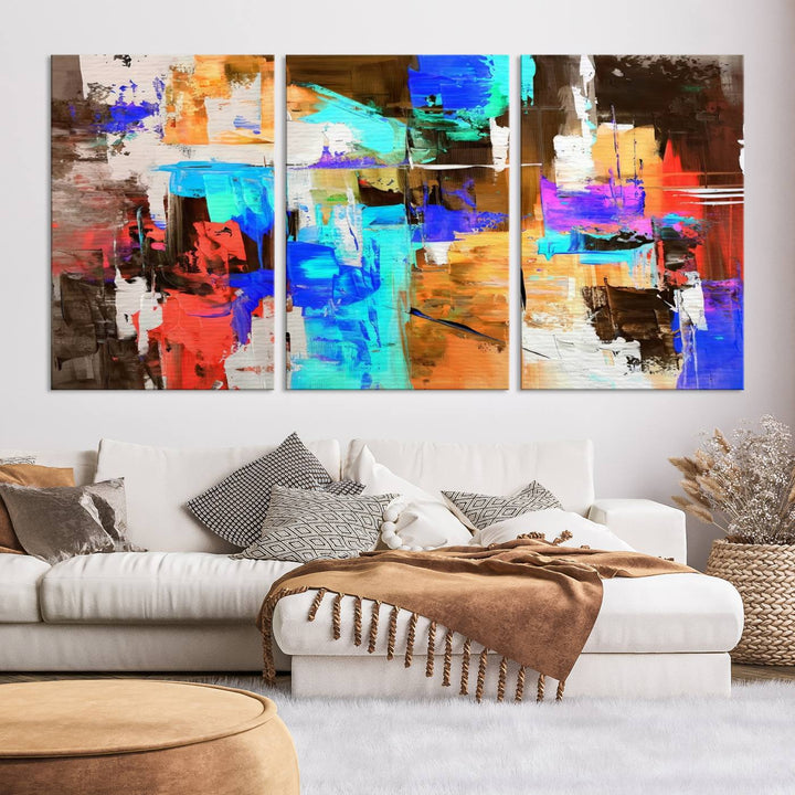 In a modern living room, the "Colorful Abstract Wall Art Canvas Print" serves as a stunning triptych centerpiece on museum-quality canvas, ready to hang. Its UV-protective coating ensures enduring vibrancy.