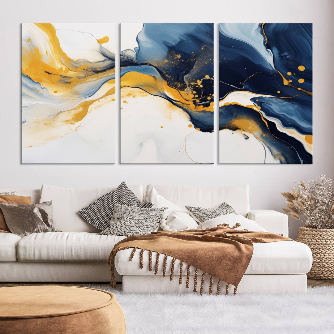 The Blue and Gold Abstract Fluid Canvas Art, with its swirling patterns, adorns the wall. This modern wall art beautifully complements the contemporary interior decor, adding an elegant touch with its rich blue, gold, and white tones.