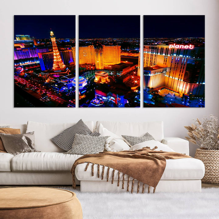 Las Vegas Wall Art Canvas Print showcases a dynamic and luminous cityscape at night with tall buildings and bustling streets. Expertly printed on museum-quality canvas, this gallery-wrapped artwork is enhanced with a UV-protective coating to ensure lasting brilliance.