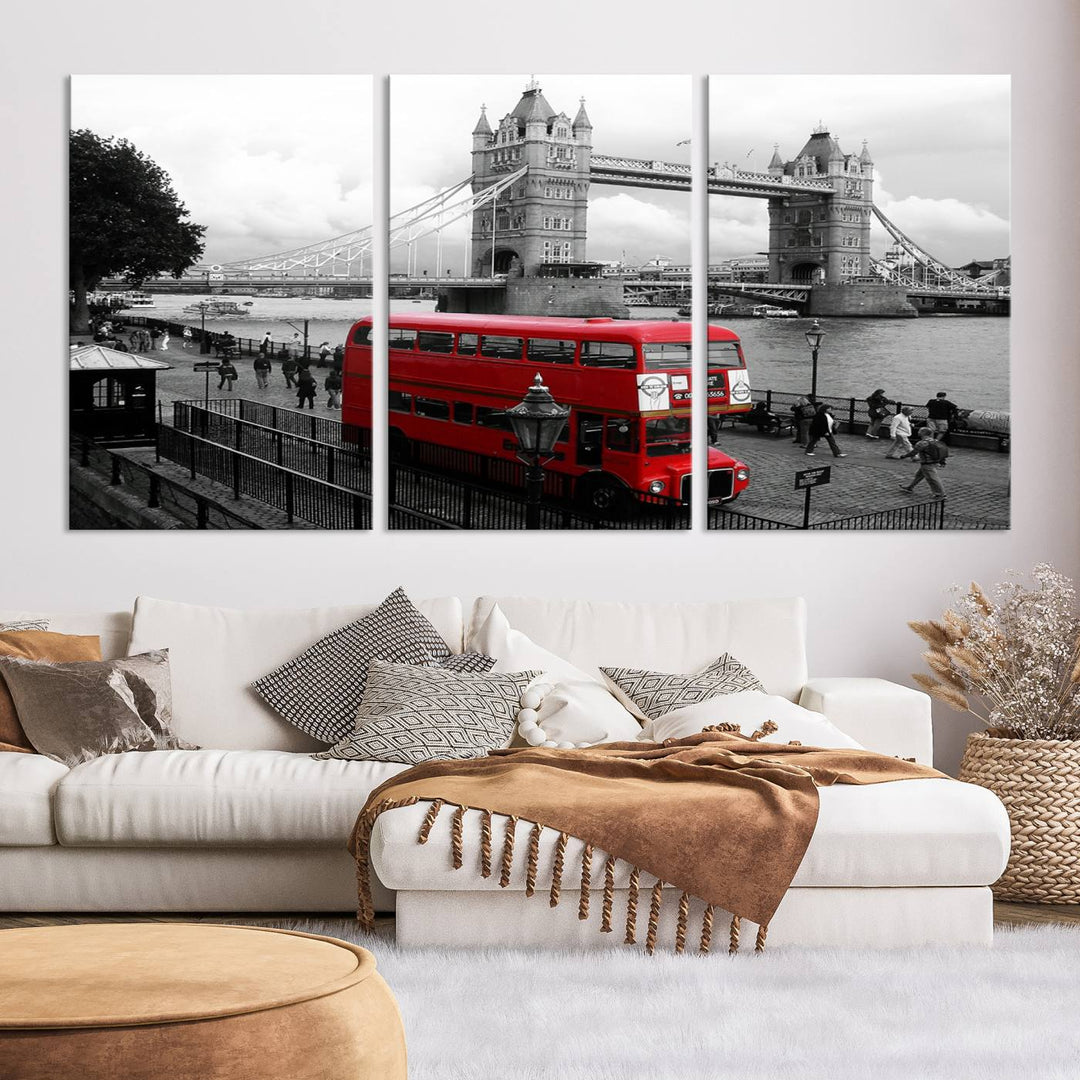 The London Red Bus and Bridge Wall Art Canvas Print showcases a red London bus in front of Tower Bridge, beautifully presented as a gallery-wrapped canvas. This striking image is divided into three panels, delivering a museum-quality display that's ready to hang.