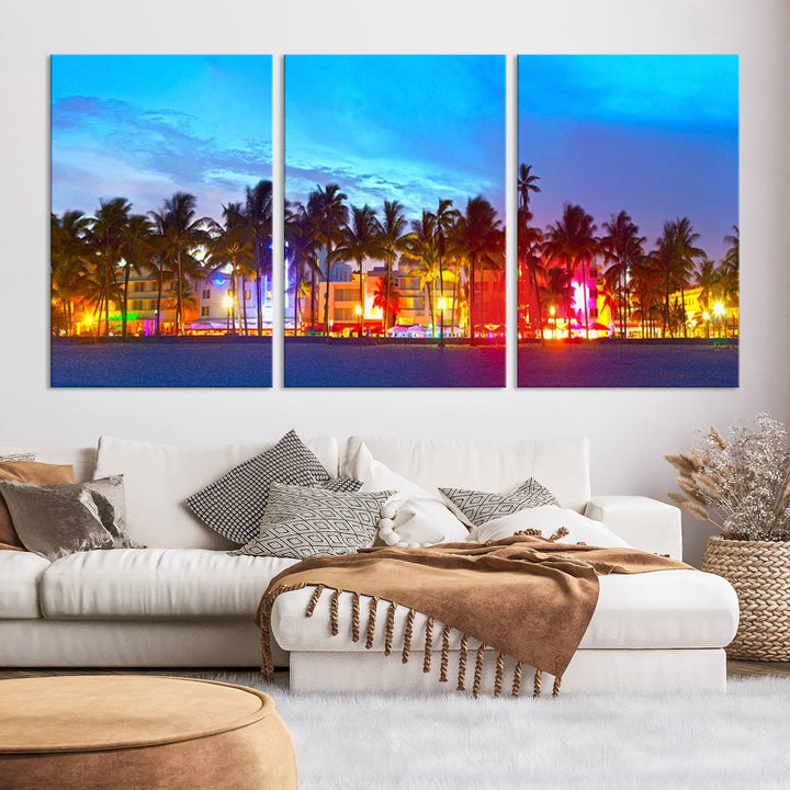 The living room features a three-panel Miami City Wall Art Canvas Print, showcasing a colorful, illuminated beach scene with palm trees on museum-quality canvas.