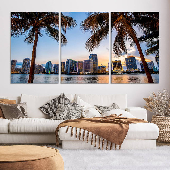 The Wall Art MIAMI Canvas Print features a triptych design depicting palm trees and a city skyline at sunset.