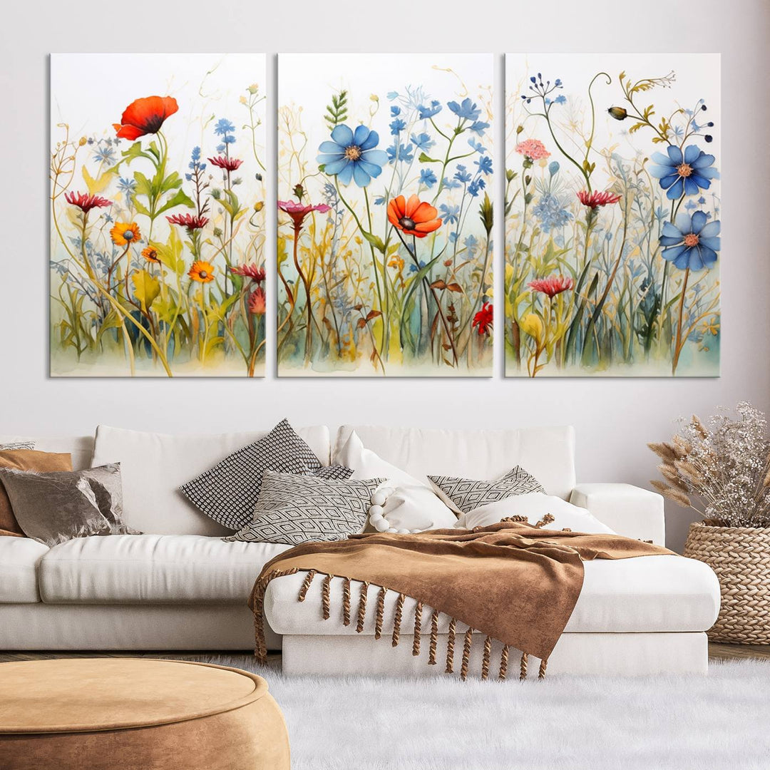 The Colorful Wildflower Canvas Wall Art – Vibrant Floral Botanical Print, consisting of a large 3 panel set, adds bright nature decor to the living room against a black wall.