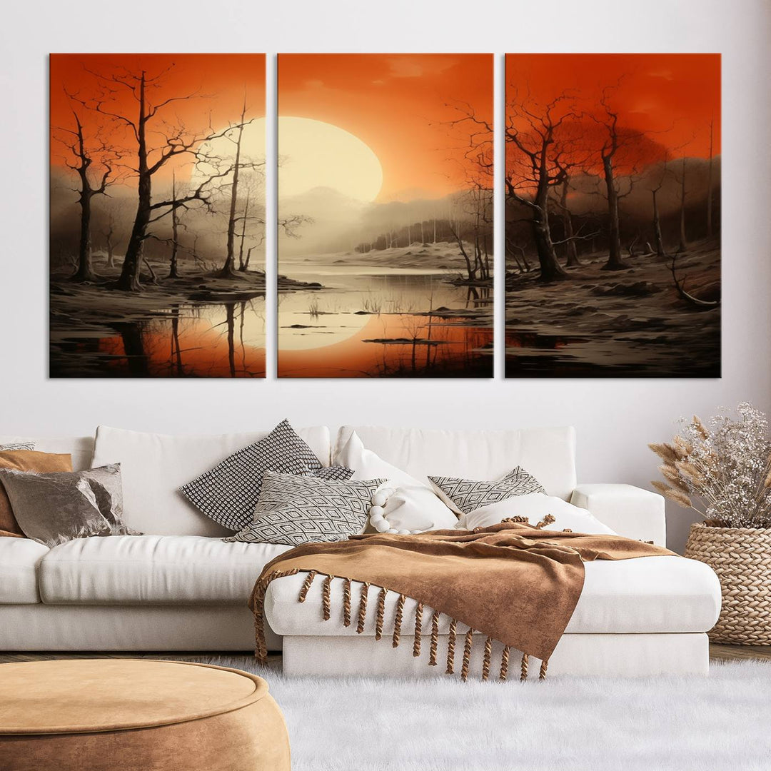 The "Abstract Watercolor Trees and Sunset on Lake Wall Art" is a triptych masterpiece, showcasing an orange-hued landscape of barren trees and a large sun. Displayed on museum-quality canvases with UV-protective coating, it creates a striking visual element in any space.