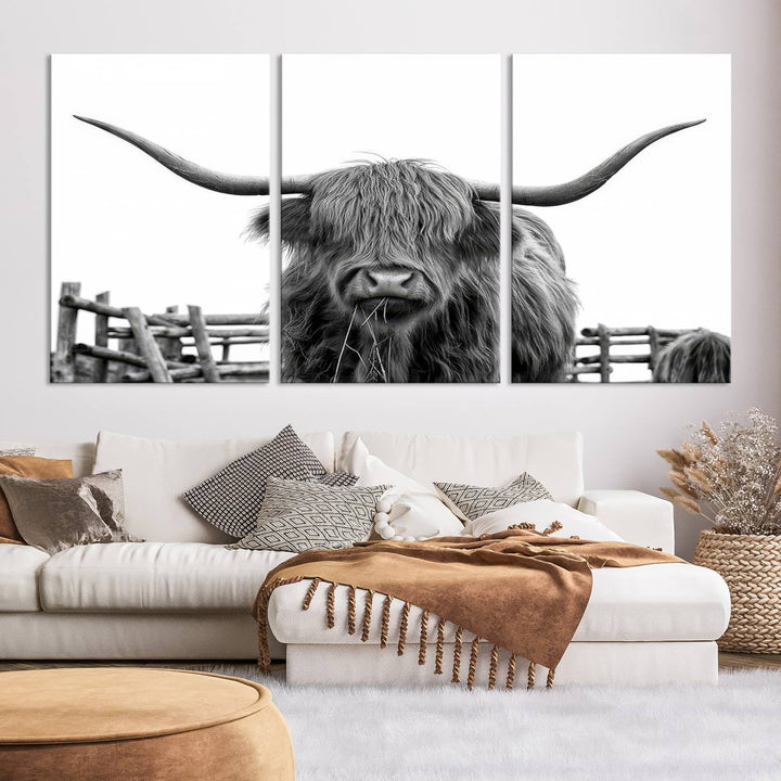 The Longhorn Canvas Print, featuring a black-and-white triptych of a Bighorn cow with shaggy fur and impressive long horns, is elegantly showcased. This wall art piece boasts a gallery-quality finish on premium canvas, bringing sophistication to any room.