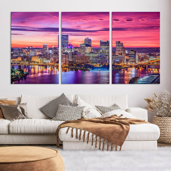 The Pittsburg Wall Art Canvas Print, showcasing a vibrant sunset glow over the city skyline and crafted by a professional artisan, adorns the space.