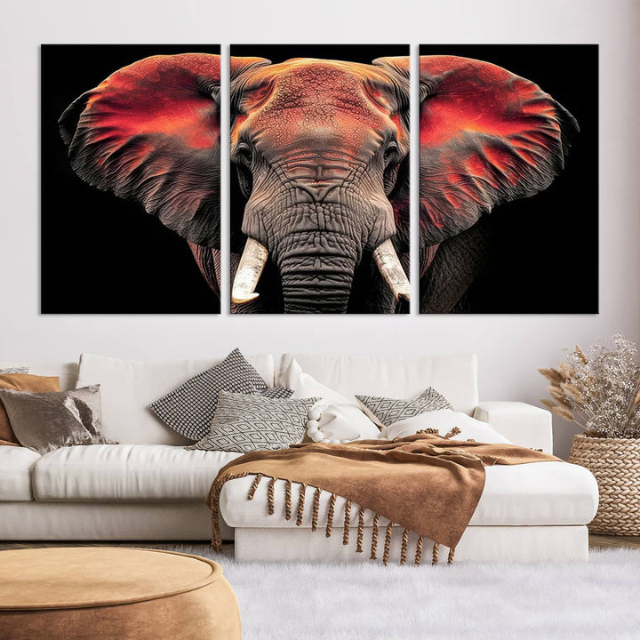 The Elephant Wall Art Canvas Print, featuring vibrant red and black tones, is a stunning artwork printed on museum-quality canvas. It comes with a UV-protective coating.