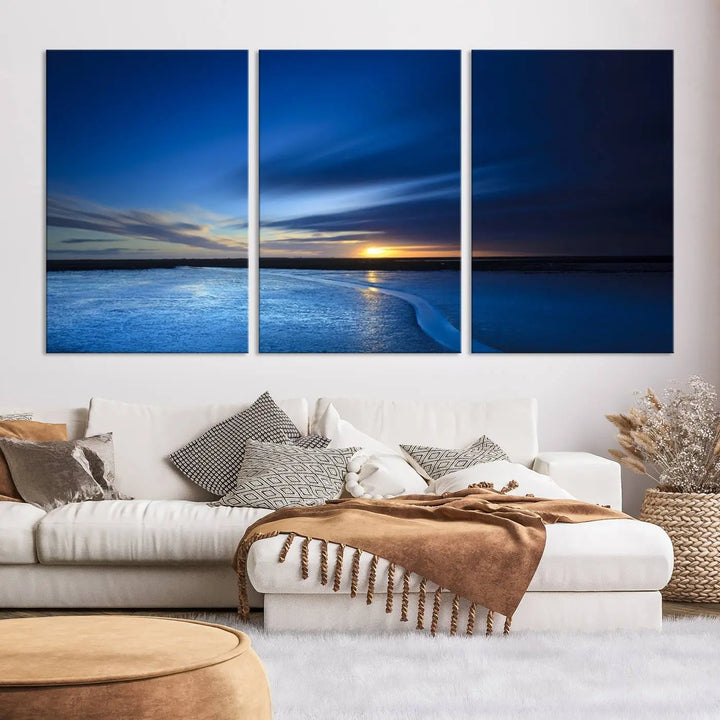 The living room features a triptych of the Wall Art Canvas Print Navy Sunset Lake Landscape Artwork, adding to its tranquil vibe.