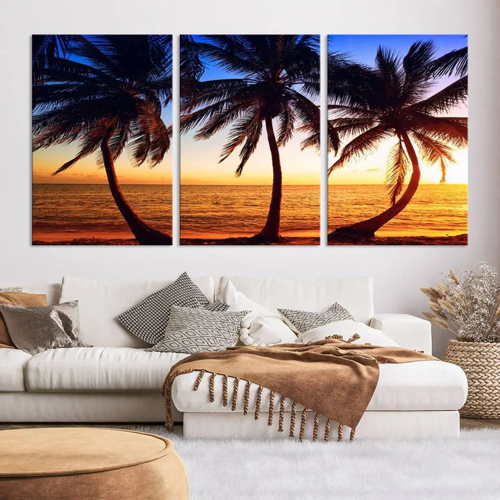 The living room features a wall adorned with the "Wall Art Canvas Curve Palms at Sunset on Beach," showcasing gallery-wrapped, museum-quality canvases in a stunning triptych.