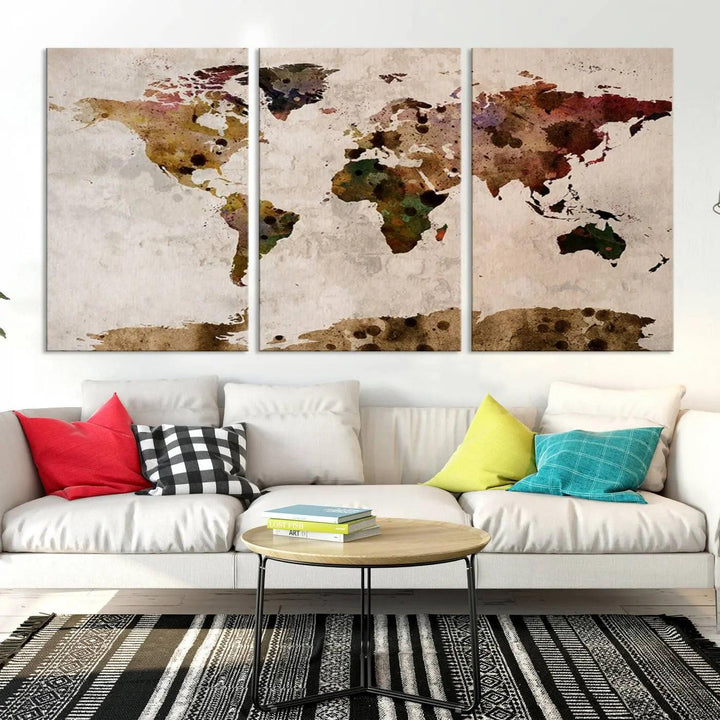 A Watercolor World Map Canvas Print, wrapped in an elegant gallery style, hangs on the wall.