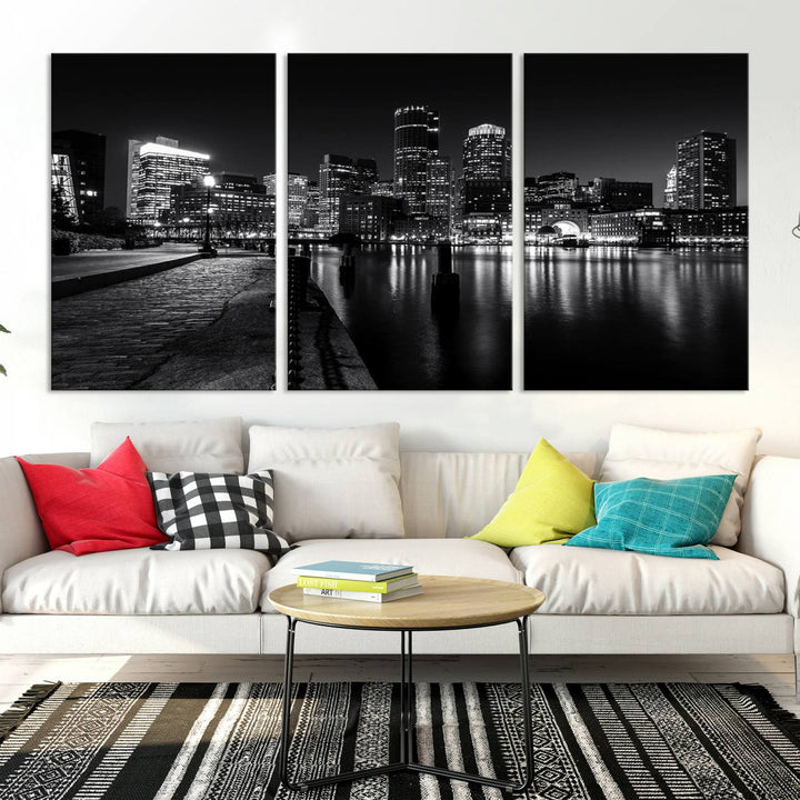 The Boston Lights Skyline Black and White Wall Art Cityscape Canvas Print, crafted with museum-quality canvas and UV-protective coating, serves as a striking triptych centerpiece in the living room.